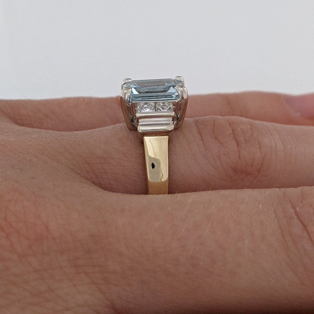 14K TWO-TONE AQUAMARINE EMERALD CUT 7X9 WITH .72 DIAMOND TOTAL WEIGHT (4) PRINCESS CUT ESTATE RING 6.2 GRAMS