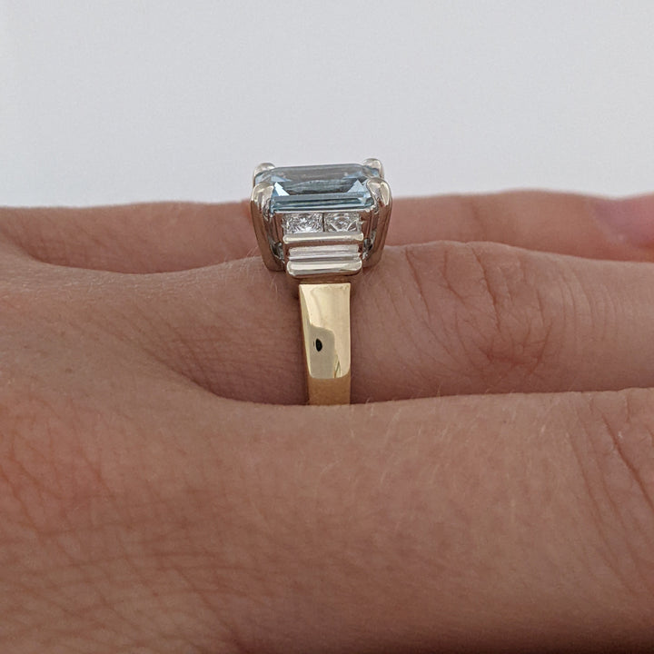 14K TWO-TONE AQUAMARINE EMERALD CUT 7X9 WITH .72 DIAMOND TOTAL WEIGHT (4) PRINCESS CUT ESTATE RING 6.2 GRAMS
