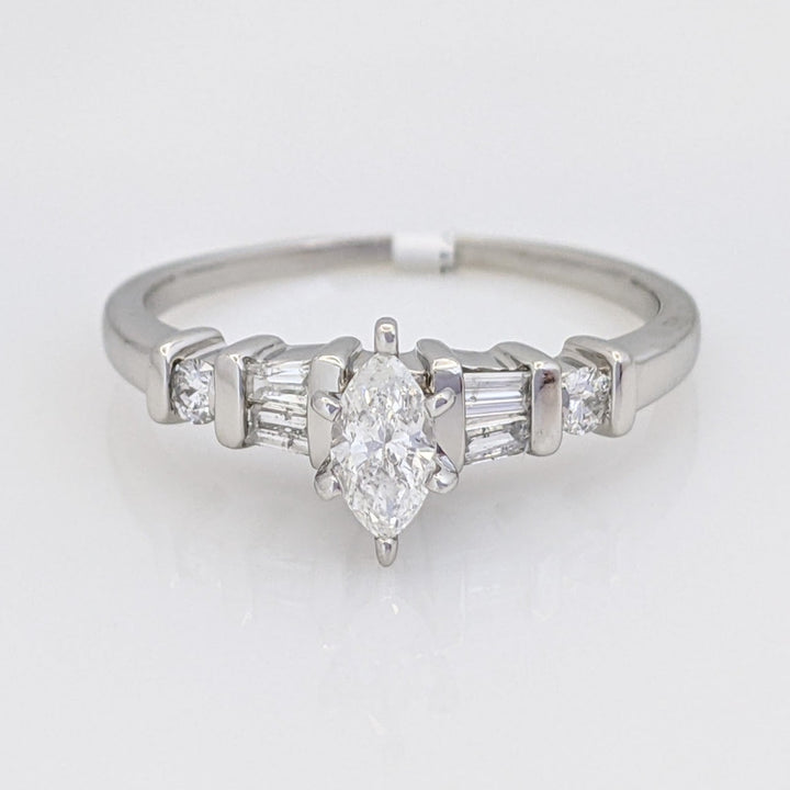 PLATINUM .41 CARAT TOTAL WEIGHT I1 F DIAMOND (1) MARQUISE CUT WITH (4) BAGUETTE CUT (2) ROUND ESTATE RING 4.0 GRAMS