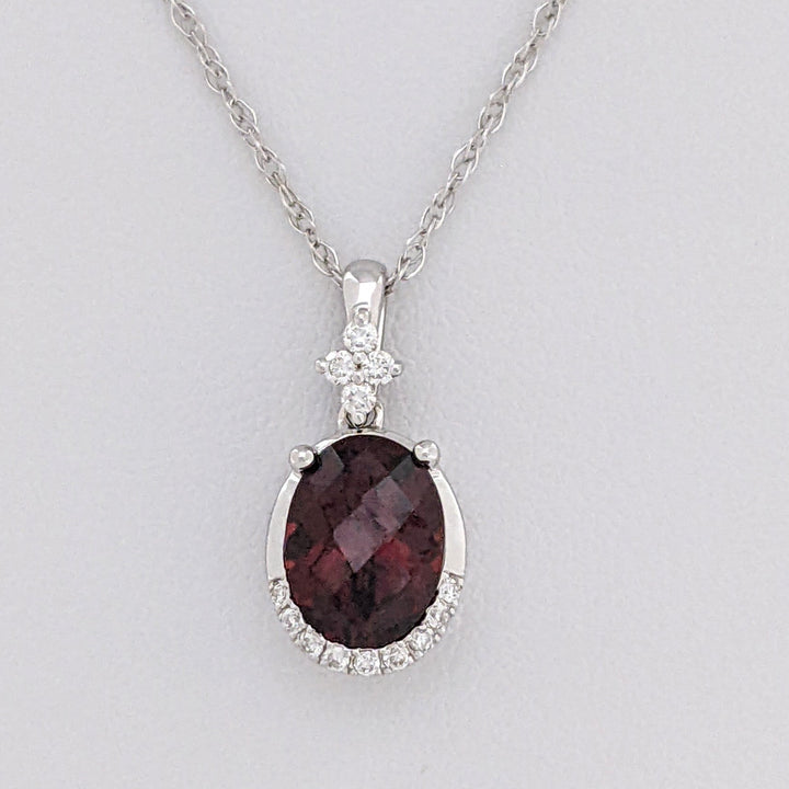 14K WHITE GARNET OVAL 1.32 CARAT TOTAL WITH .08 DIAMOND TOTAL WEIGHT ESTATE PENDANT & CHAIN 2.0 GRAMS