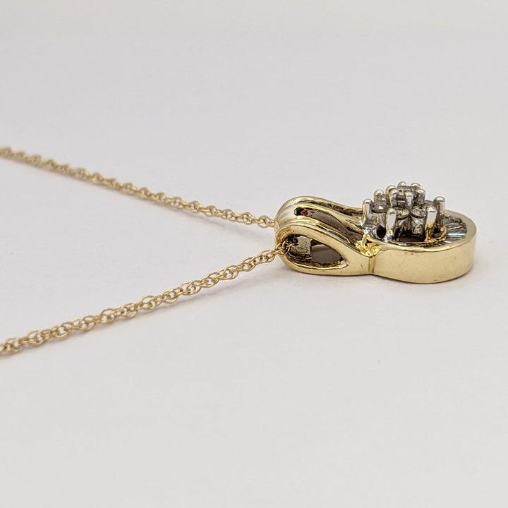 10K .50 CARAT TOTAL WEIGHT I1 K DIAMOND ROUND (7) BAGUETTE (28) ESTATE CLUSTER PENDANT & CHAIN 3.6 GRAMS