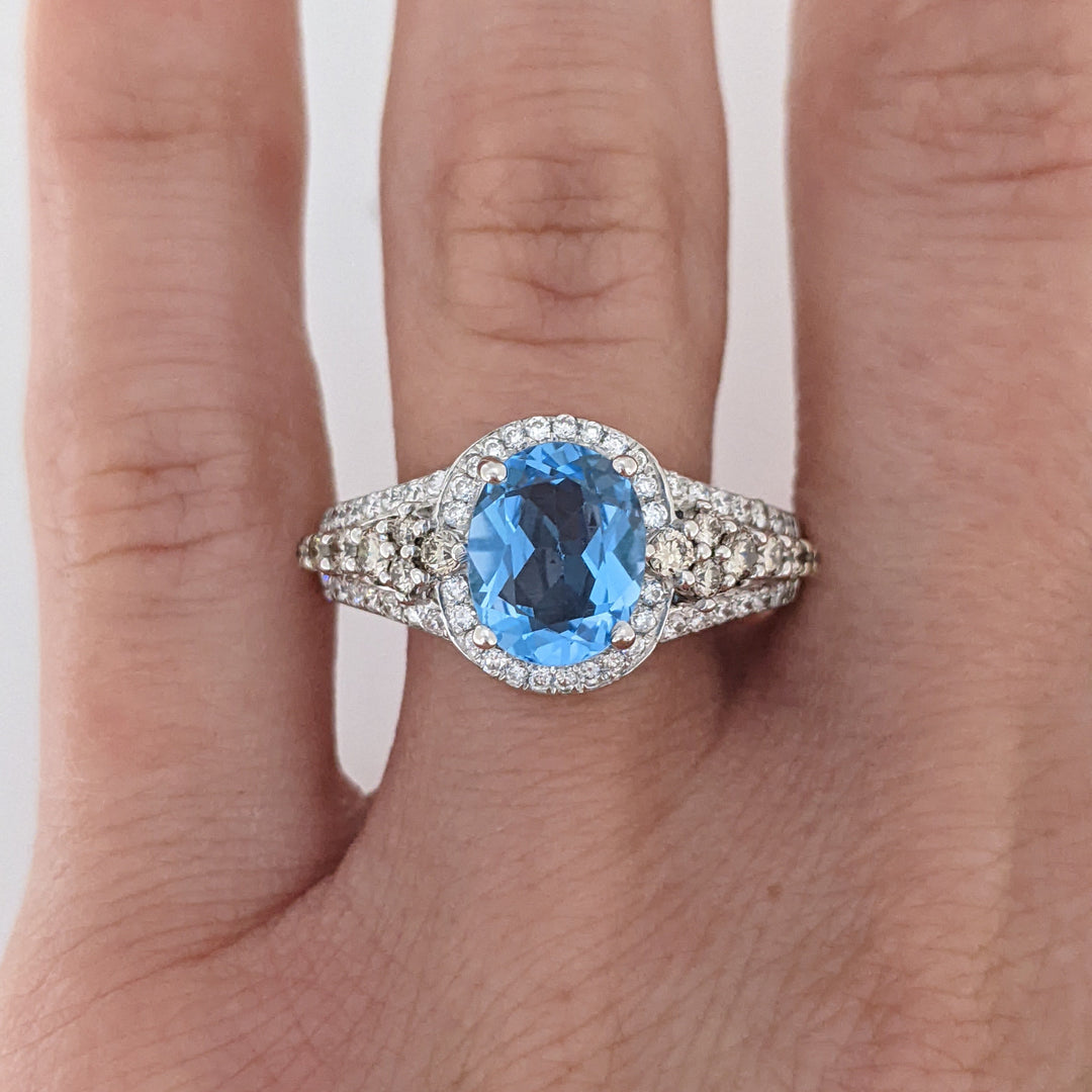 14K WHITE BLUE TOPAZ OVAL 7X9 WITH .66 DIAMOND TOTAL WEIGHT "LEVIAN" ESTATE RING 4.6 GRAMS
