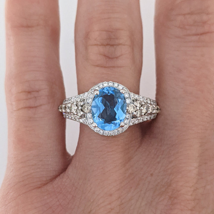 14K WHITE BLUE TOPAZ OVAL 7X9 WITH .66 DIAMOND TOTAL WEIGHT "LEVIAN" ESTATE RING 4.6 GRAMS