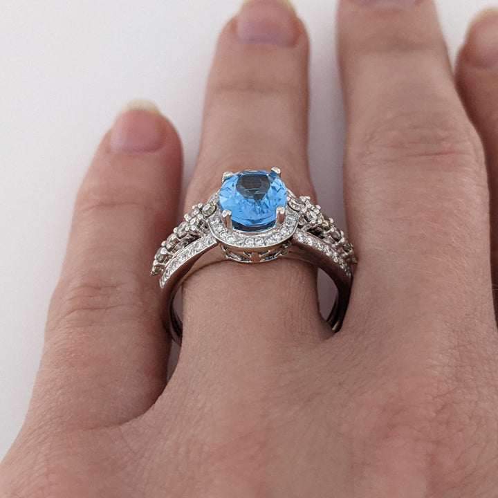 14K WHITE BLUE TOPAZ OVAL 7X9 WITH .66 DIAMOND TOTAL WEIGHT "LEVIAN" ESTATE RING 4.6 GRAMS