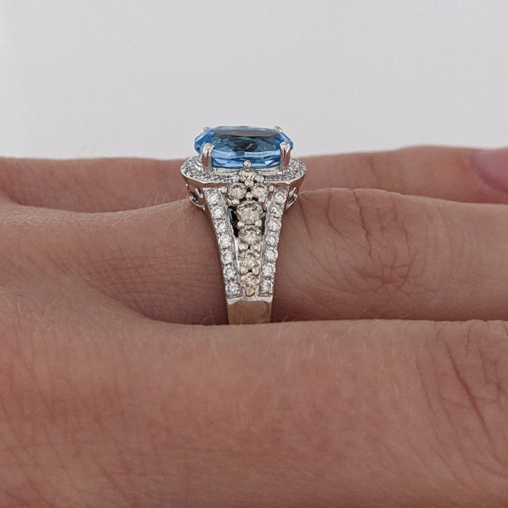 14K WHITE BLUE TOPAZ OVAL 7X9 WITH .66 DIAMOND TOTAL WEIGHT "LEVIAN" ESTATE RING 4.6 GRAMS