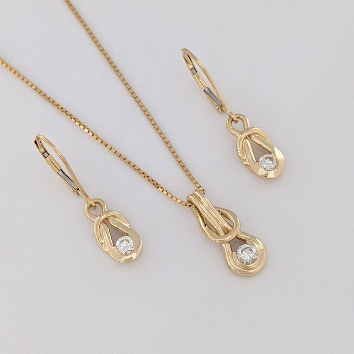 14K .45 CARAT TOTAL WEIGHT SI2-I1 H-I DIAMOND ROUND (3) LOVE KNOT ESTATE PENDANT, CHAIN, AND EARRING SET