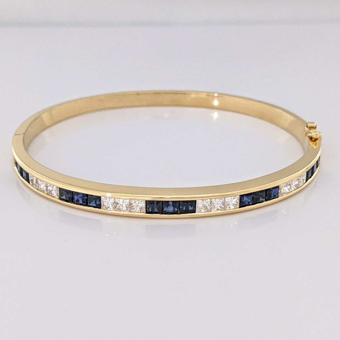 18K SAPPHIRE PRINCESS CUT (15) DIAMOND PRINCESS CUT (12) 2.5MM CHANNEL ESTATE BANGLE 18.2 GRAMS