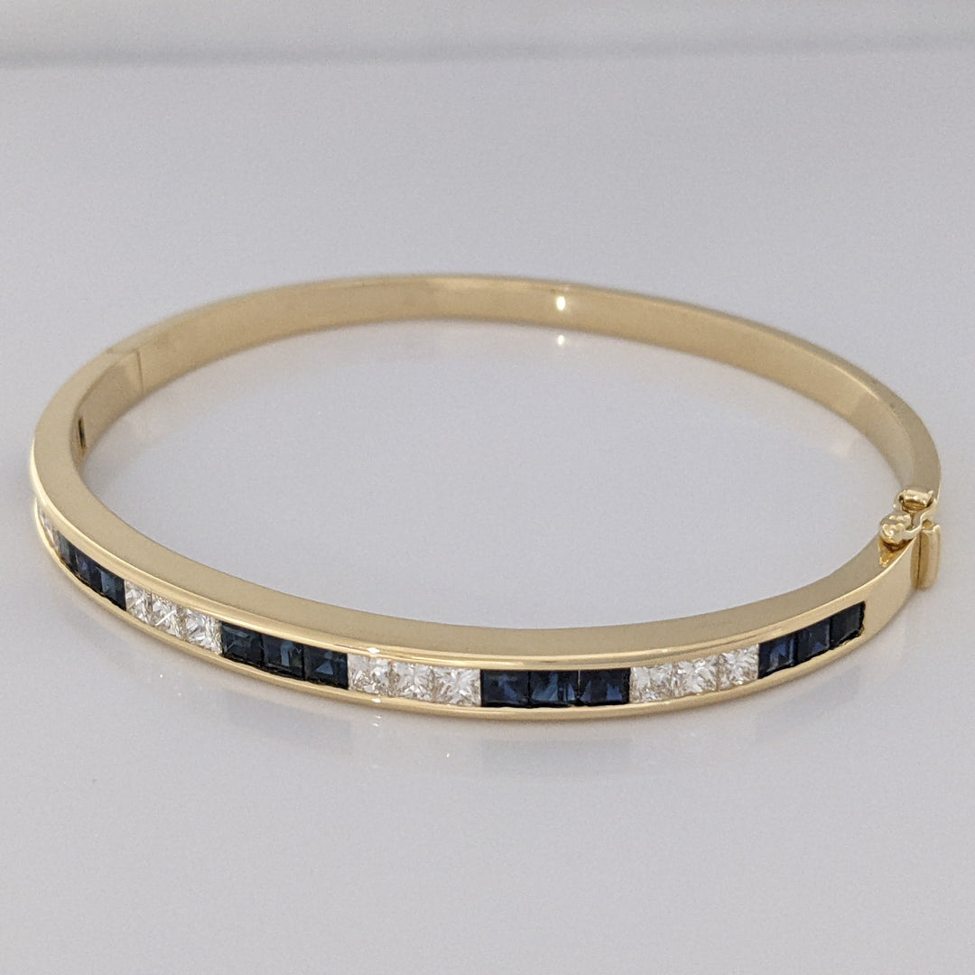 18K SAPPHIRE PRINCESS CUT (15) DIAMOND PRINCESS CUT (12) 2.5MM CHANNEL ESTATE BANGLE 18.2 GRAMS
