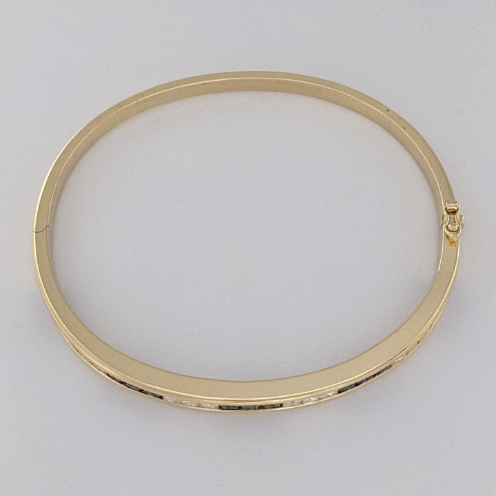 18K SAPPHIRE PRINCESS CUT (15) DIAMOND PRINCESS CUT (12) 2.5MM CHANNEL ESTATE BANGLE 18.2 GRAMS