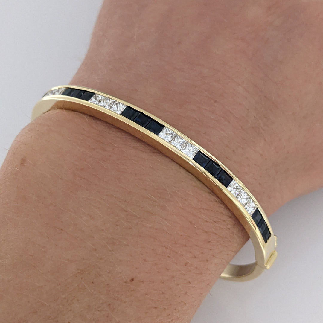 18K SAPPHIRE PRINCESS CUT (15) DIAMOND PRINCESS CUT (12) 2.5MM CHANNEL ESTATE BANGLE 18.2 GRAMS