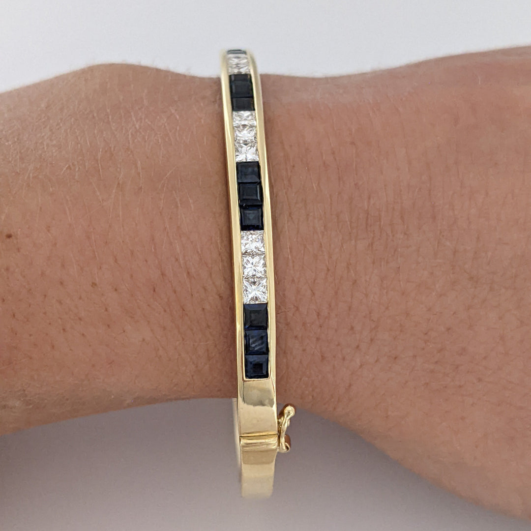 18K SAPPHIRE PRINCESS CUT (15) DIAMOND PRINCESS CUT (12) 2.5MM CHANNEL ESTATE BANGLE 18.2 GRAMS