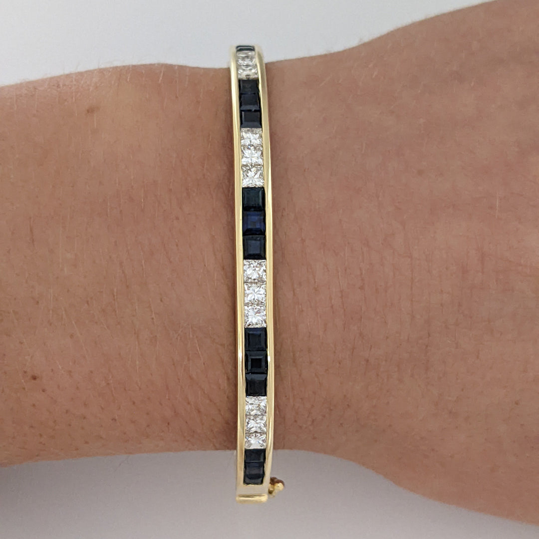 18K SAPPHIRE PRINCESS CUT (15) DIAMOND PRINCESS CUT (12) 2.5MM CHANNEL ESTATE BANGLE 18.2 GRAMS