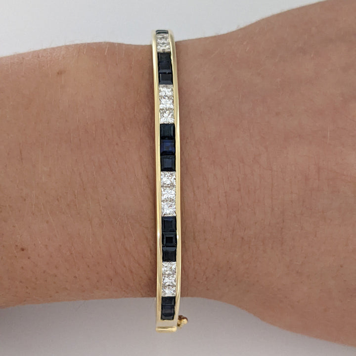 18K SAPPHIRE PRINCESS CUT (15) DIAMOND PRINCESS CUT (12) 2.5MM CHANNEL ESTATE BANGLE 18.2 GRAMS