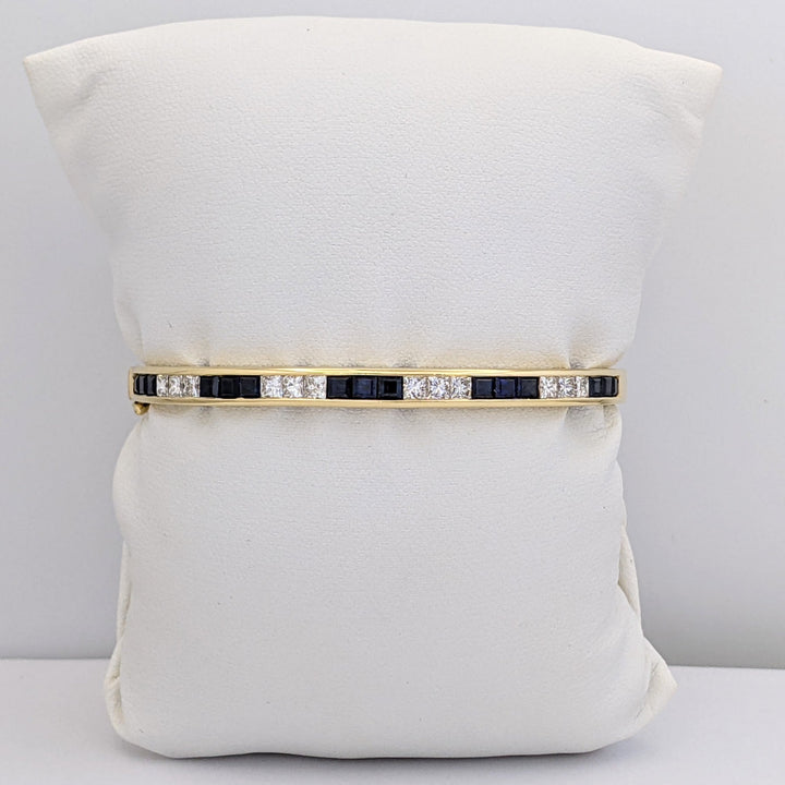 18K SAPPHIRE PRINCESS CUT (15) DIAMOND PRINCESS CUT (12) 2.5MM CHANNEL ESTATE BANGLE 18.2 GRAMS