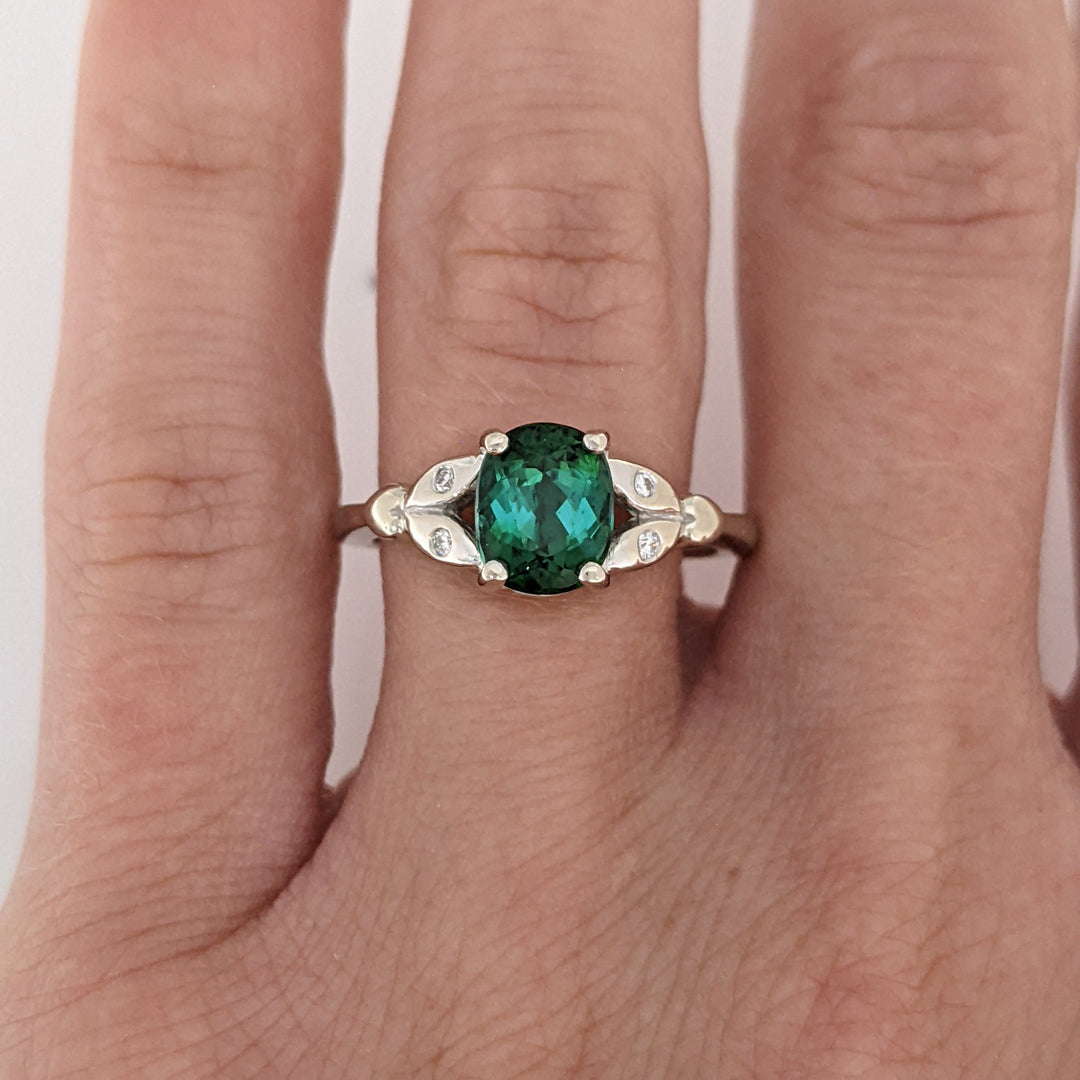 14K WHITE GREEN TOURMALINE OVAL 1.46 CARAT TOTAL WITH .04 DIAMOND TOTAL WEIGHT LEAF ESTATE RING 3.1 GRAMS