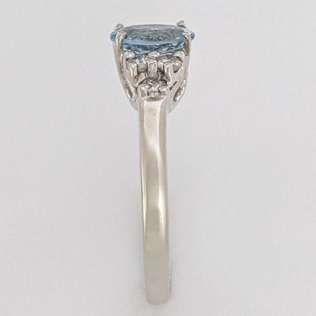 14K WHITE AQUAMARINE "A" OVAL 5X7 WITH .18 DIAMOND TOTAL WEIGHT (6) ROUND ESTATE RING 3.3 GRAMS