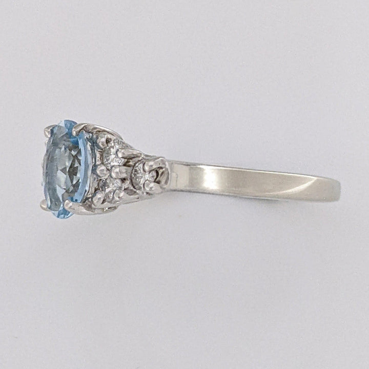 14K WHITE AQUAMARINE "A" OVAL 5X7 WITH .18 DIAMOND TOTAL WEIGHT (6) ROUND ESTATE RING 3.3 GRAMS
