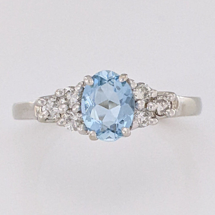 14K WHITE AQUAMARINE "A" OVAL 5X7 WITH .18 DIAMOND TOTAL WEIGHT (6) ROUND ESTATE RING 3.3 GRAMS