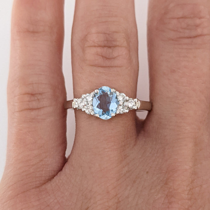 14K WHITE AQUAMARINE "A" OVAL 5X7 WITH .18 DIAMOND TOTAL WEIGHT (6) ROUND ESTATE RING 3.3 GRAMS