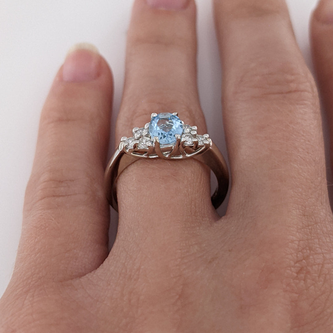 14K WHITE AQUAMARINE "A" OVAL 5X7 WITH .18 DIAMOND TOTAL WEIGHT (6) ROUND ESTATE RING 3.3 GRAMS