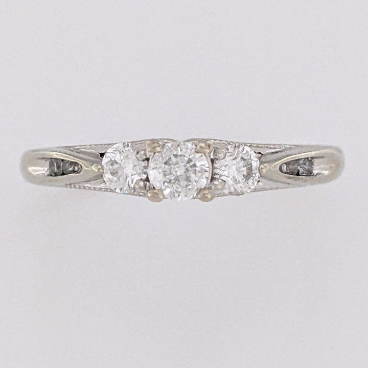 10K WHITE .32 CARAT TOTAL WEIGHT I1 H DIAMOND ROUND (7) ESTATE TRINITY RING 2.0 GRAMS