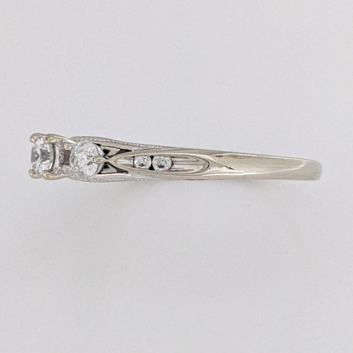 10K WHITE .32 CARAT TOTAL WEIGHT I1 H DIAMOND ROUND (7) ESTATE TRINITY RING 2.0 GRAMS