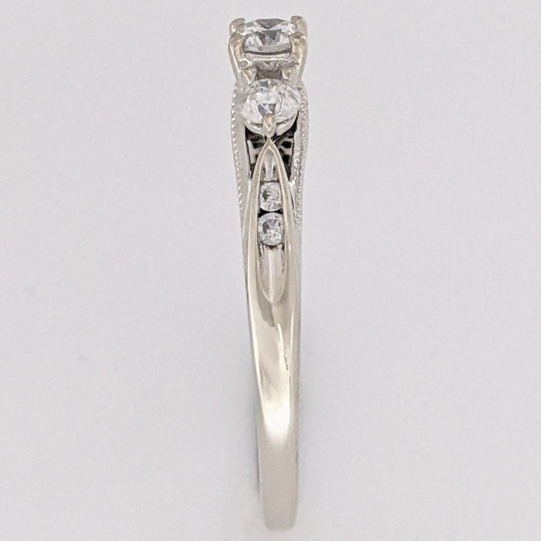 10K WHITE .32 CARAT TOTAL WEIGHT I1 H DIAMOND ROUND (7) ESTATE TRINITY RING 2.0 GRAMS