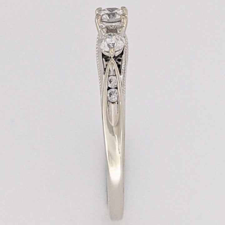 10K WHITE .32 CARAT TOTAL WEIGHT I1 H DIAMOND ROUND (7) ESTATE TRINITY RING 2.0 GRAMS