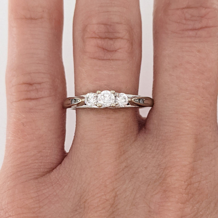 10K WHITE .32 CARAT TOTAL WEIGHT I1 H DIAMOND ROUND (7) ESTATE TRINITY RING 2.0 GRAMS