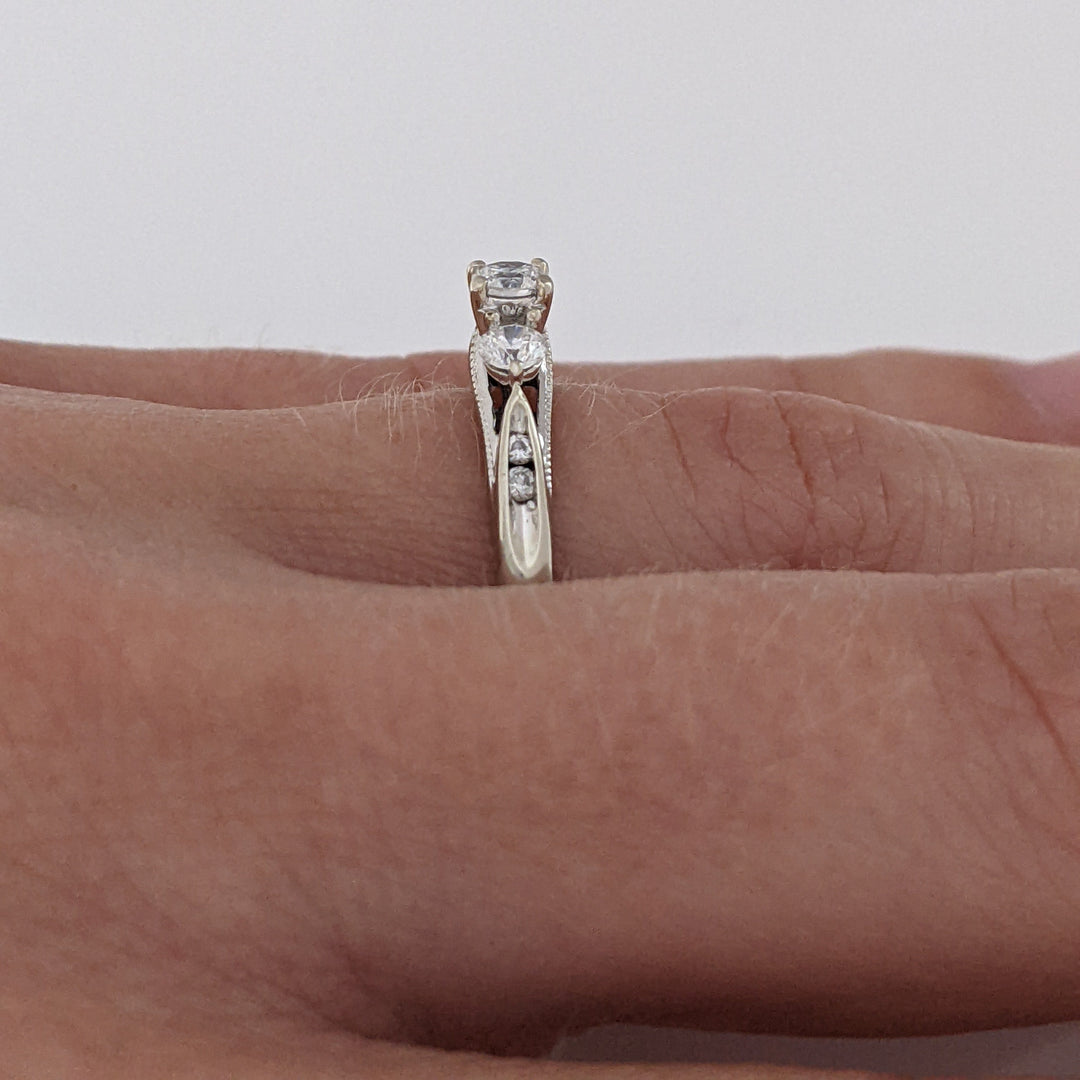 10K WHITE .32 CARAT TOTAL WEIGHT I1 H DIAMOND ROUND (7) ESTATE TRINITY RING 2.0 GRAMS