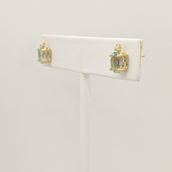 14K AQUAMARINE OVAL 5X7 WITH MELEE ESTATE EARRINGS 1.3 GRAMS
