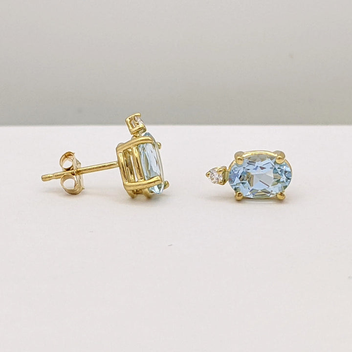 14K AQUAMARINE OVAL 5X7 WITH MELEE ESTATE EARRINGS 1.3 GRAMS