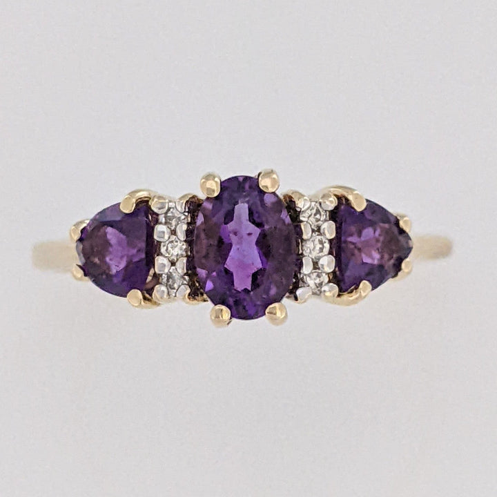 10K AMETHYST OVAL 4X6 WITH (2) TRILLION 4MM WITH (6) MELEE ESTATE RING 1.9 GRAMS