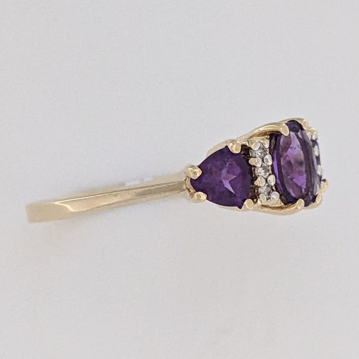 10K AMETHYST OVAL 4X6 WITH (2) TRILLION 4MM WITH (6) MELEE ESTATE RING 1.9 GRAMS