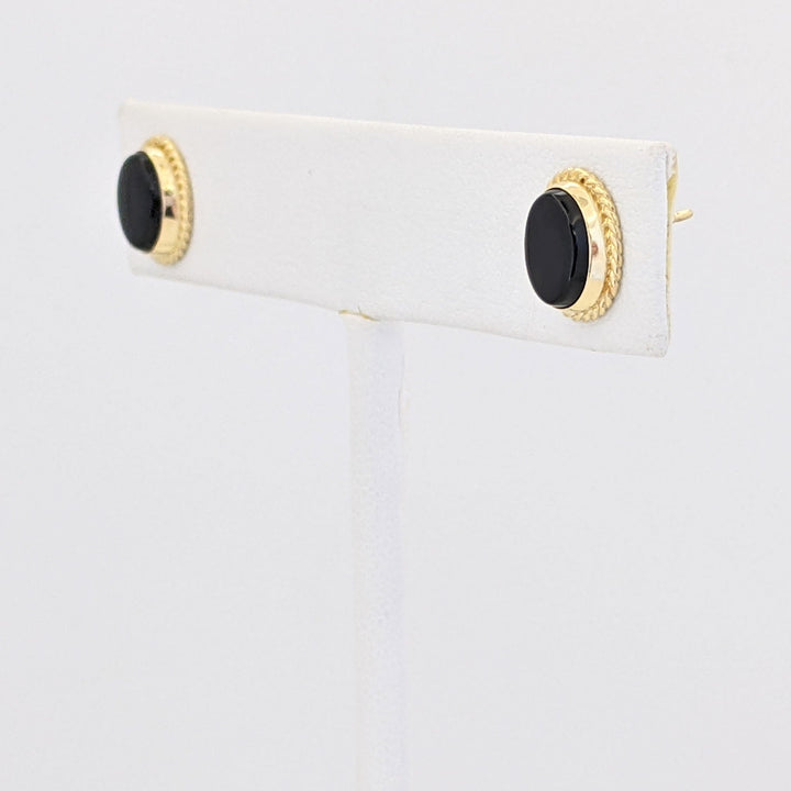 14K ONYX OVAL 5.5X8MM WITH GOLD TRIM ESTATE EARRINGS 1.2 GRAMS