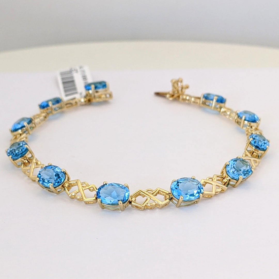 14K BLUE TOPAZ OVAL (11) 6X8 WITH LINK ESTATE BRACELET 10.9 GRAMS