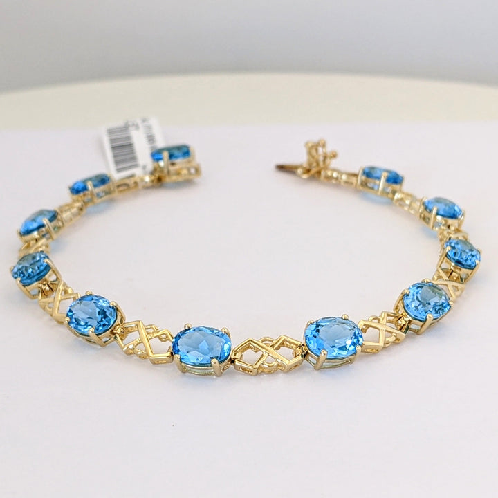 14K BLUE TOPAZ OVAL (11) 6X8 WITH LINK ESTATE BRACELET 10.9 GRAMS