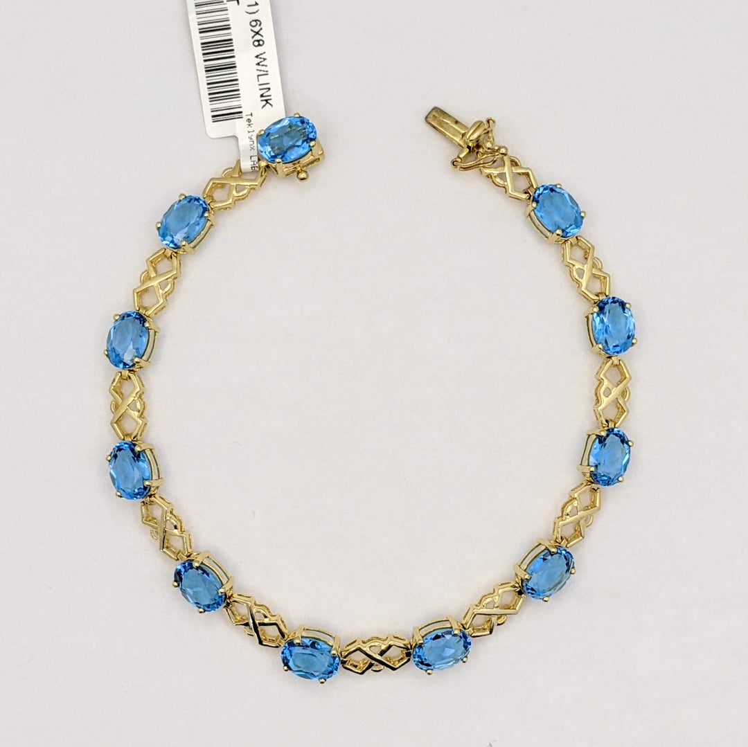 14K BLUE TOPAZ OVAL (11) 6X8 WITH LINK ESTATE BRACELET 10.9 GRAMS