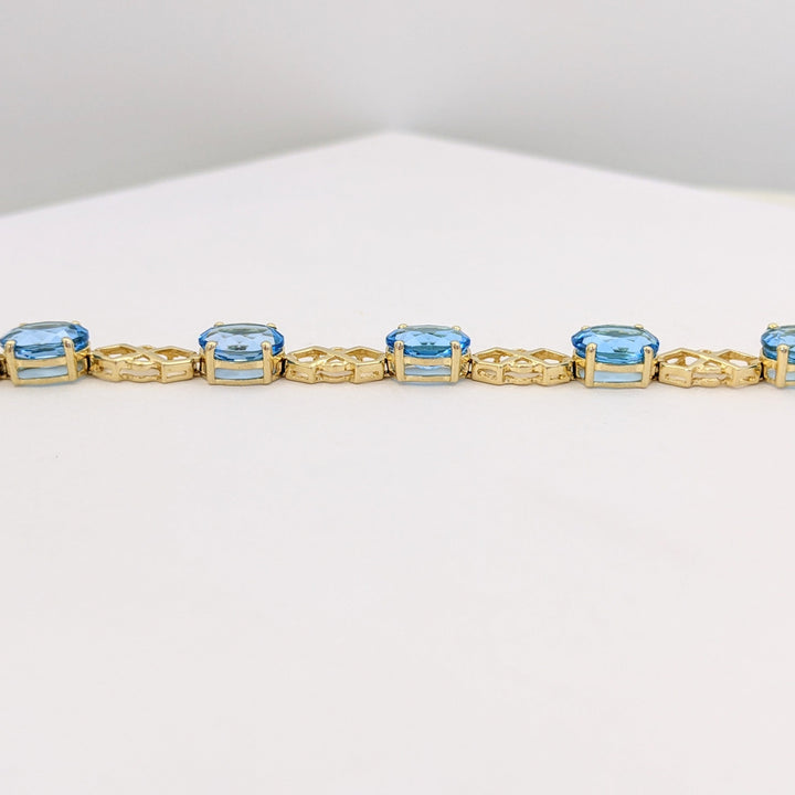 14K BLUE TOPAZ OVAL (11) 6X8 WITH LINK ESTATE BRACELET 10.9 GRAMS