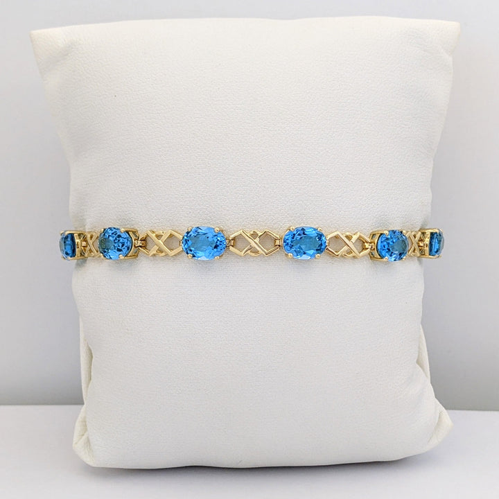14K BLUE TOPAZ OVAL (11) 6X8 WITH LINK ESTATE BRACELET 10.9 GRAMS