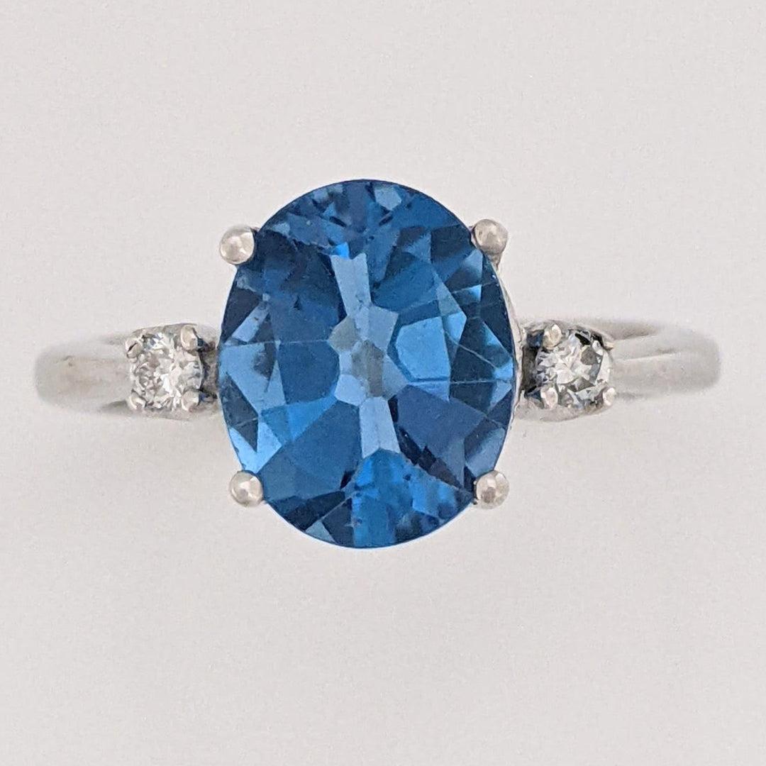 18K WHITE LONDON BLUE TOPAZ OVAL 8X10 WITH (2) MELEE ESTATE RING 4.4 GRAMS