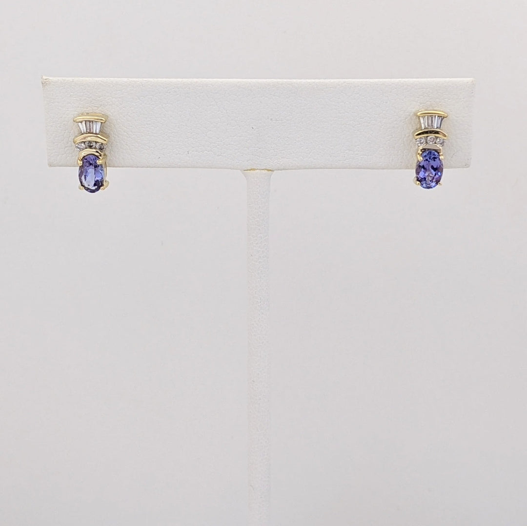 14K TANZANITE OVAL 4X6 WITH .18 DIAMOND TOTAL WEIGHT (6) ROUND (6) BAGUETTE ESTATE EARRINGS 2.1 GRAMS