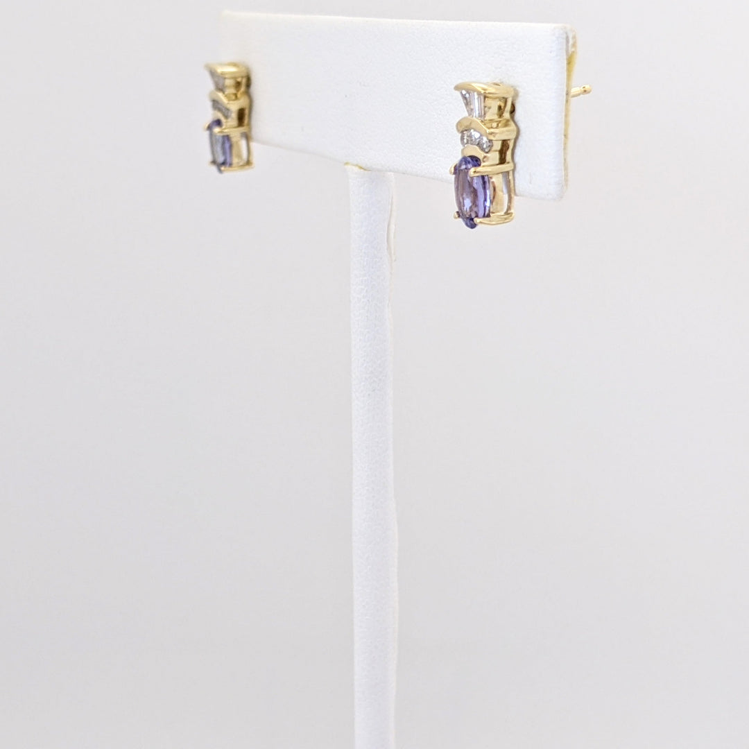 14K TANZANITE OVAL 4X6 WITH .18 DIAMOND TOTAL WEIGHT (6) ROUND (6) BAGUETTE ESTATE EARRINGS 2.1 GRAMS