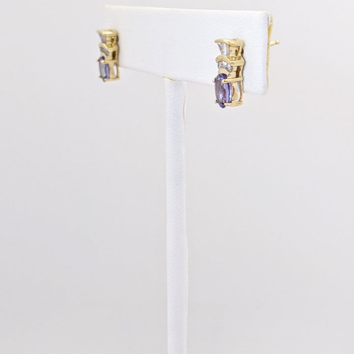 14K TANZANITE OVAL 4X6 WITH .18 DIAMOND TOTAL WEIGHT (6) ROUND (6) BAGUETTE ESTATE EARRINGS 2.1 GRAMS