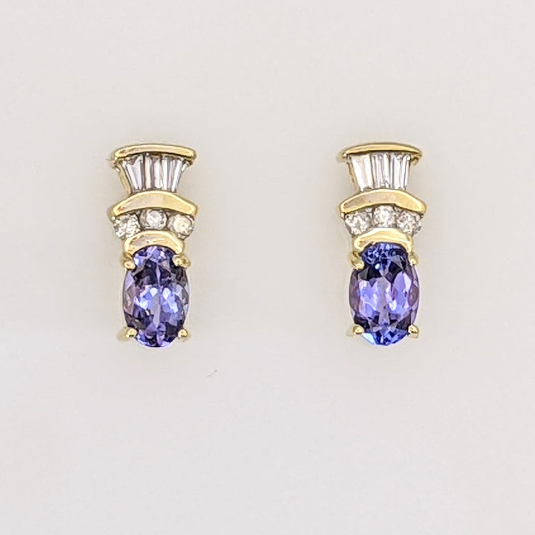 14K TANZANITE OVAL 4X6 WITH .18 DIAMOND TOTAL WEIGHT (6) ROUND (6) BAGUETTE ESTATE EARRINGS 2.1 GRAMS