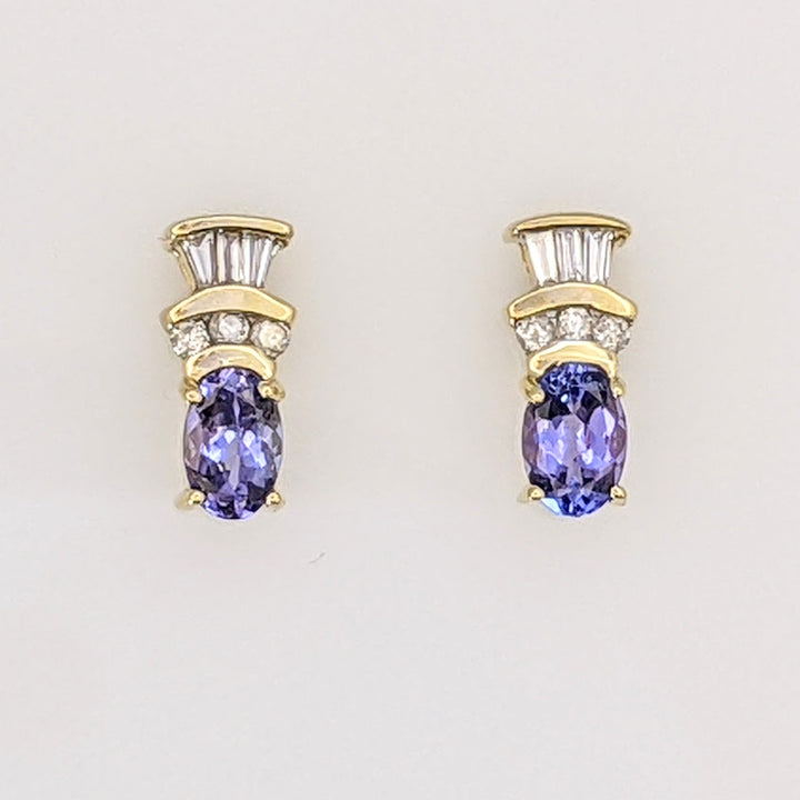 14K TANZANITE OVAL 4X6 WITH .18 DIAMOND TOTAL WEIGHT (6) ROUND (6) BAGUETTE ESTATE EARRINGS 2.1 GRAMS