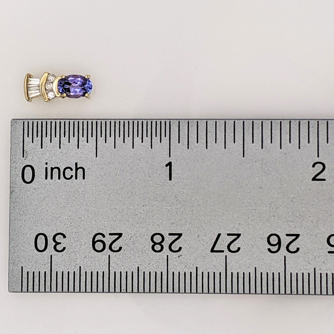 14K TANZANITE OVAL 4X6 WITH .18 DIAMOND TOTAL WEIGHT (6) ROUND (6) BAGUETTE ESTATE EARRINGS 2.1 GRAMS