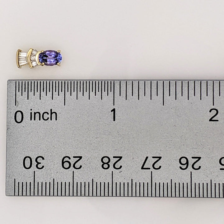 14K TANZANITE OVAL 4X6 WITH .18 DIAMOND TOTAL WEIGHT (6) ROUND (6) BAGUETTE ESTATE EARRINGS 2.1 GRAMS