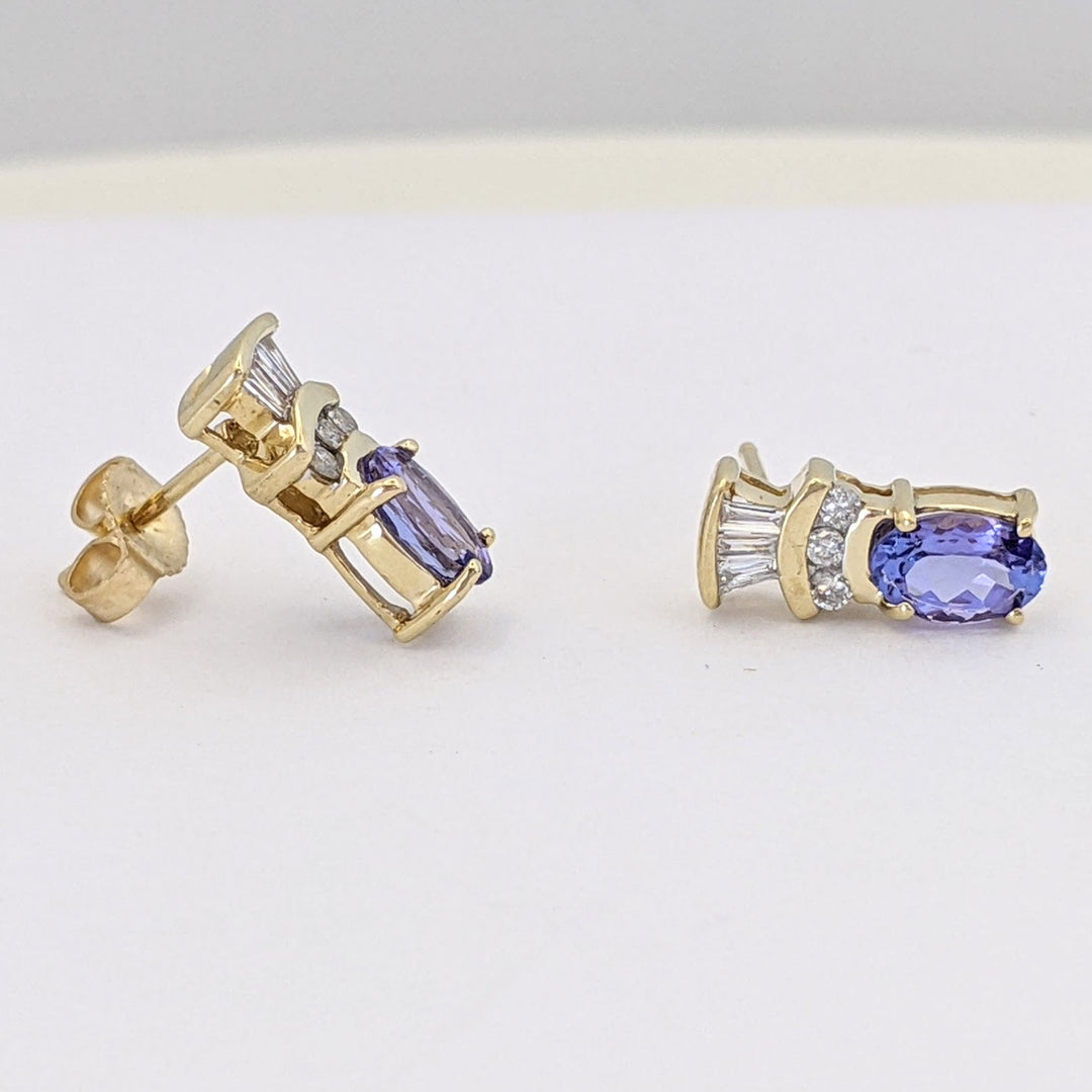 14K TANZANITE OVAL 4X6 WITH .18 DIAMOND TOTAL WEIGHT (6) ROUND (6) BAGUETTE ESTATE EARRINGS 2.1 GRAMS
