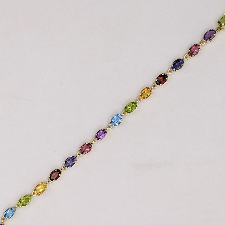 14K IOLITE, TOURMALINE, AMETHYST, BLUE TOPAZ, PERIDOT, CITRINE, GARNET OVAL 4X6 ESTATE BRACELET 6.7 GRAMS